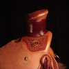 Douglas 38 Wade - tree by Rick Reed, 15 and 1/4 inch seat, Gullet - 7 and 1/2 inch by 6 and 1/4 inch by 4 inch, Horn 3 inch round, 90 degree bars, 7/8ths flat palte riggin, Cheyenne Roll, Sheridan Style Floral Carving bordered with Vaquero Lace.